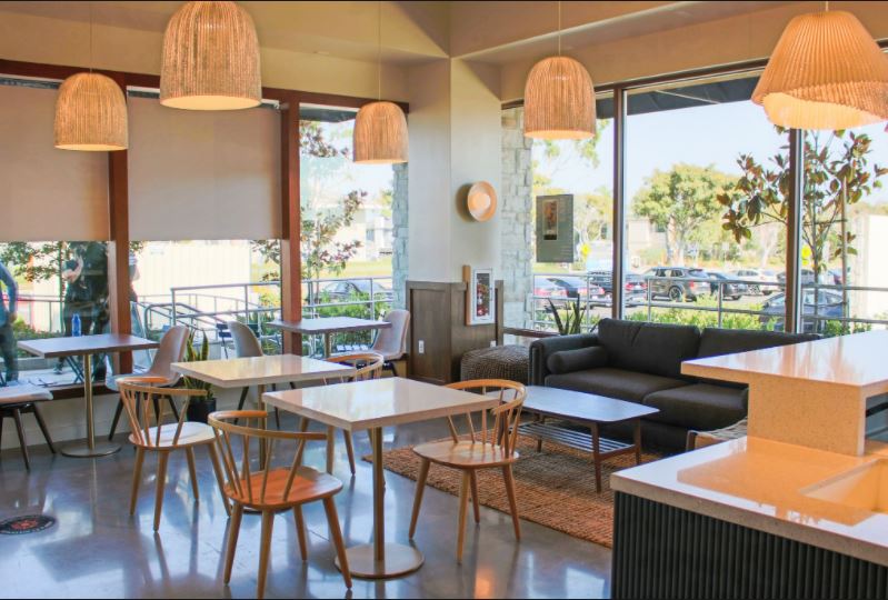 Mullions in an Earth Bar Cafe in California were wrapped in a walnut Architectural Fusion to match the natural aesthetic of the rest of the store.